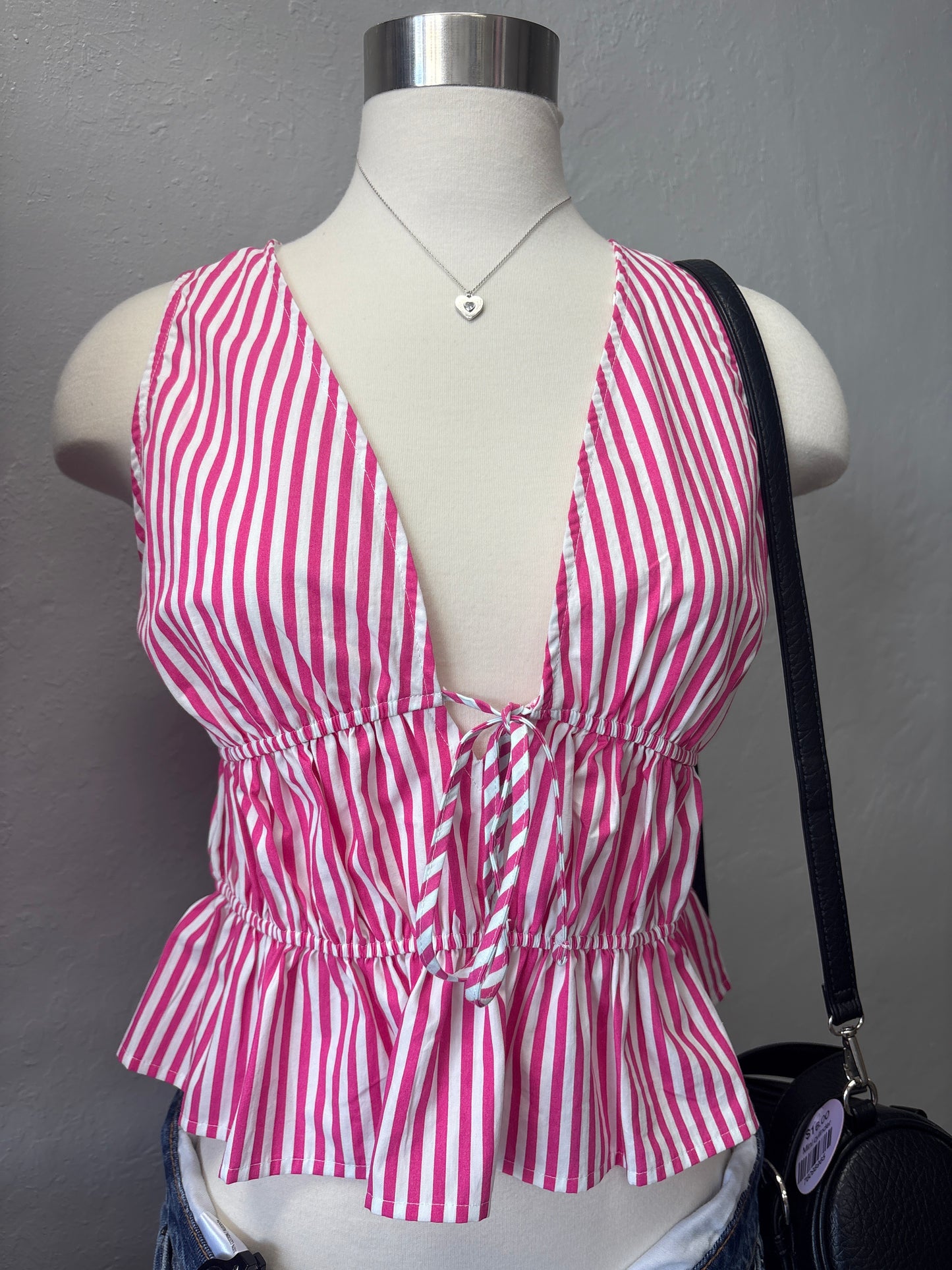 Pink peplum striped top