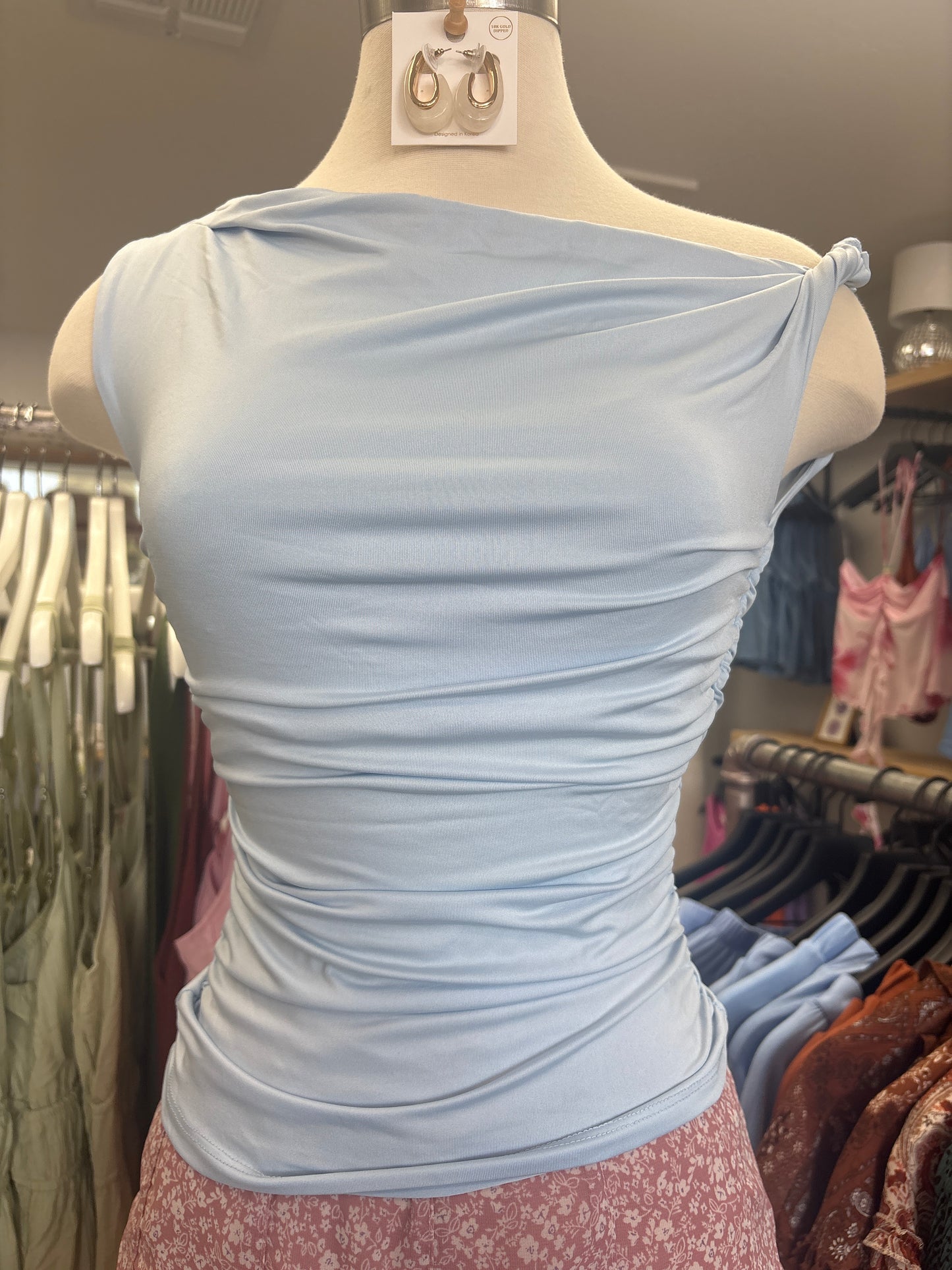 Asymmetrical off the shoulder top light blue